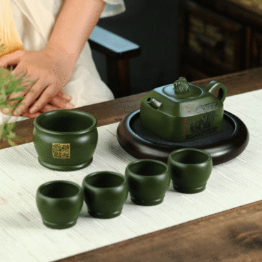 Full Handmade Yixing Zisha Teapot [Wanxiang Gengxin] 1 Pot 5 Cups Set (Douqing sha – 260ml)