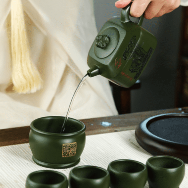Full Handmade Yixing Zisha Teapot [Wanxiang Gengxin] 1 Pot 5 Cups Set (Douqing sha – 260ml)